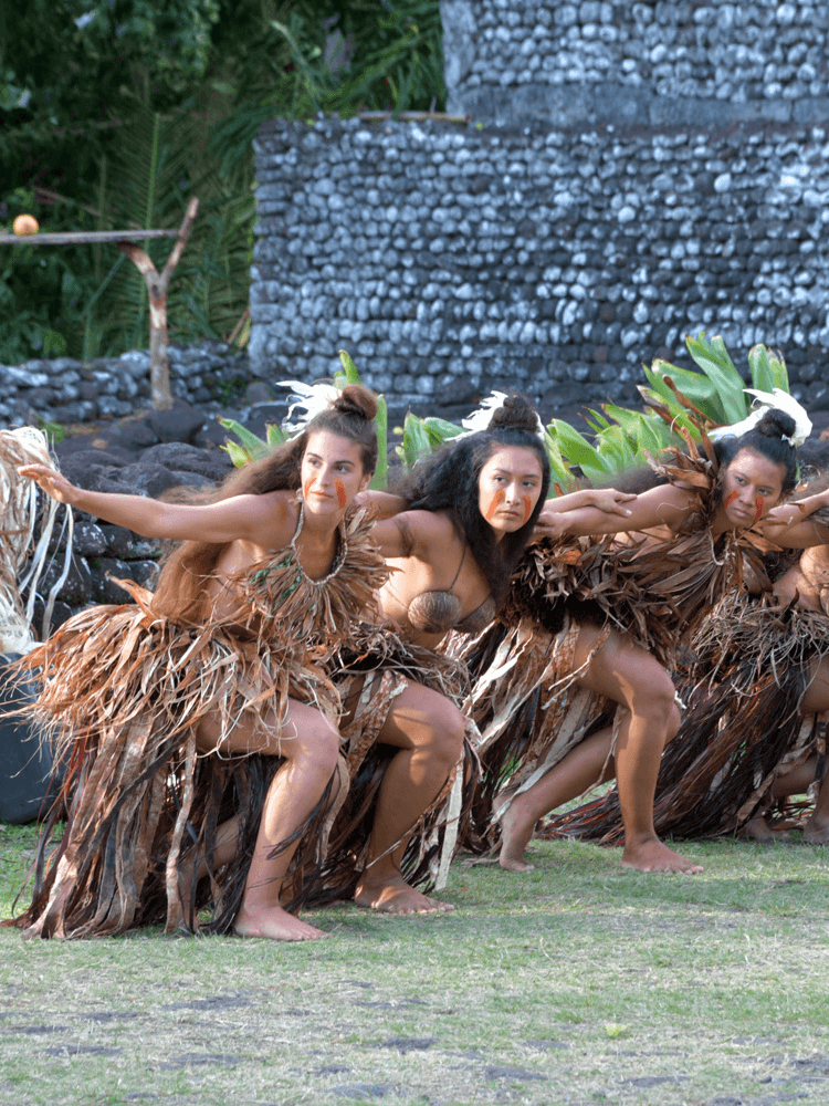 Unique Tahiti - Tours of Tahiti - Local Dancers in a Line in Front of Ruins