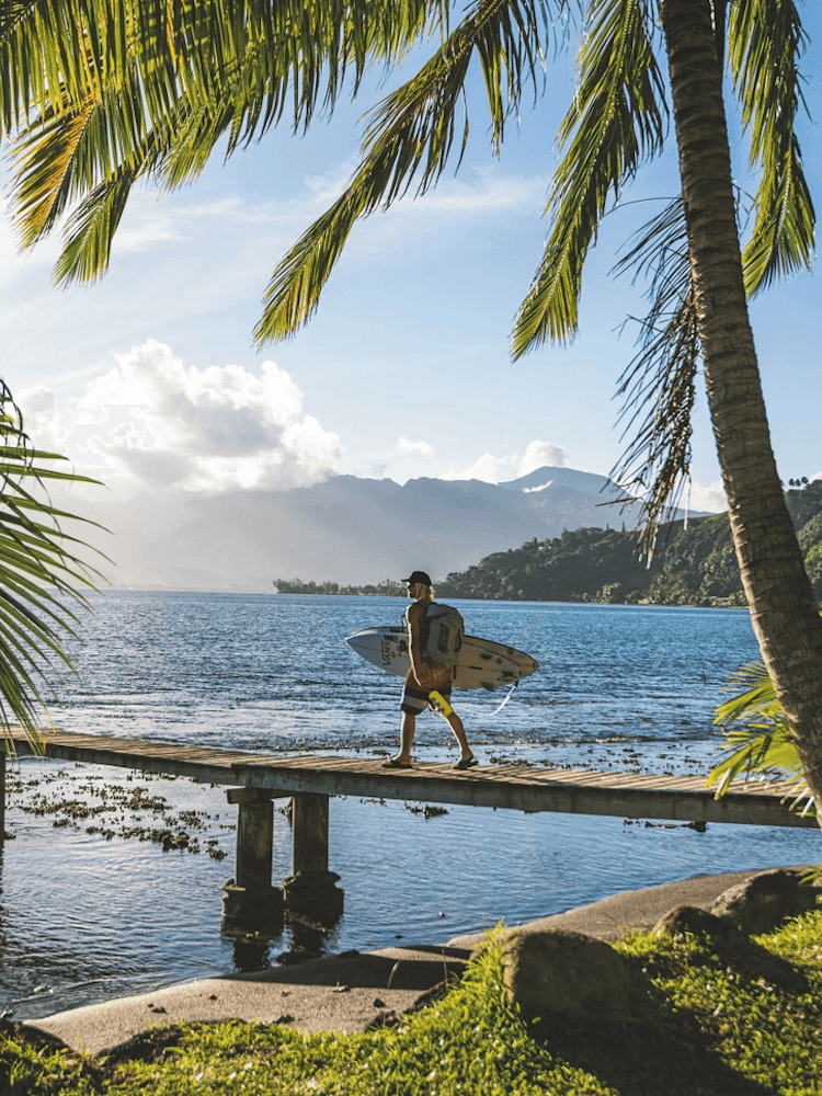 Unique Tahiti - Tours of Tahiti - Surfer on a Dock
