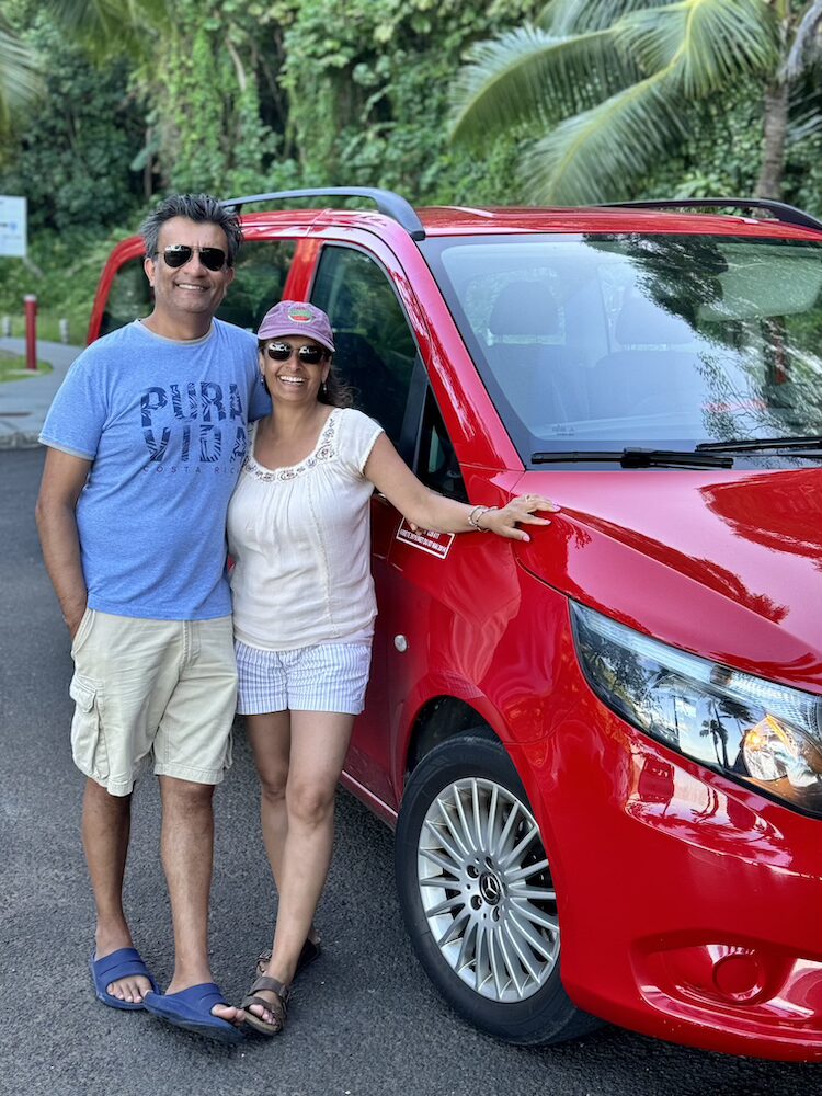 West Coast Half Day Tour of Tahiti - Couple Posing with the Signature Red Van
