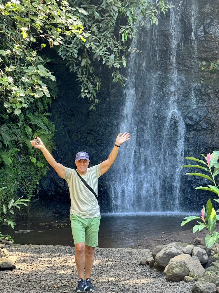 West Coast Half Day Tour of Tahiti - Posing In Front of a Waterfall in the Bontanical Garden