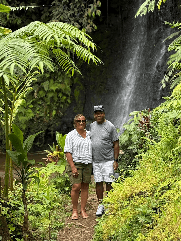 West Cost Half Day Tour of Tahiti - Couple Stopping to Pose by a Waterfall