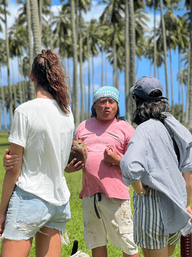 West Cost Half Day Tour of Tahiti - Guide Talking About Coconuts with Tour Guests