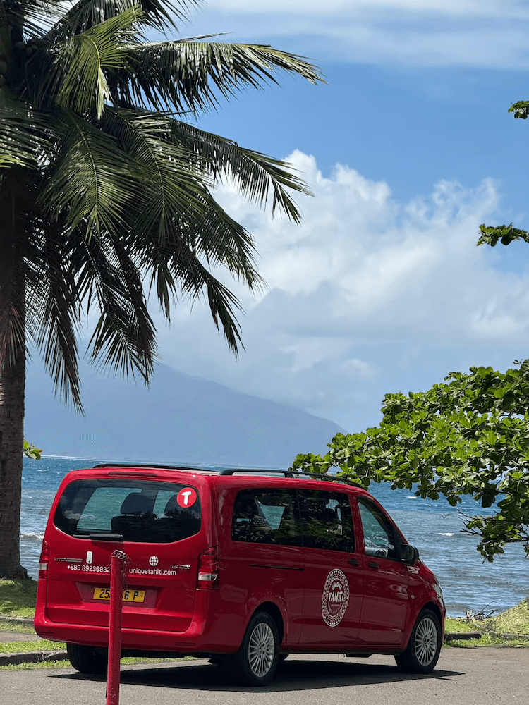 West Cost Half Day Tour of Tahiti - Signature Red Van in Front of Beautiful Scenery