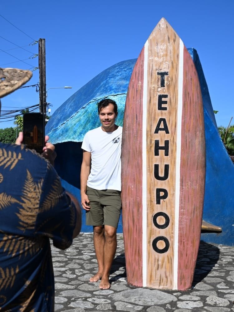 Posing-for-Photos-with-a-Surf-Board-Statue-in-Teahupoo-Village.jpg