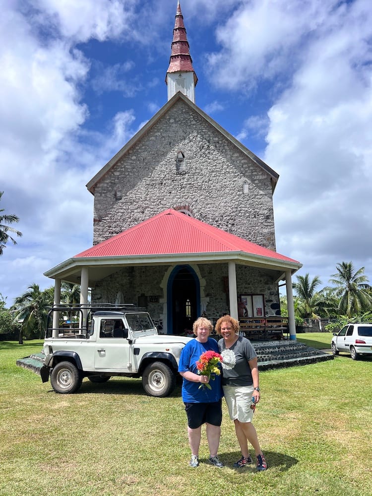 East Coast Tour of Tahiti - Tourists with Flowers in Front of Church